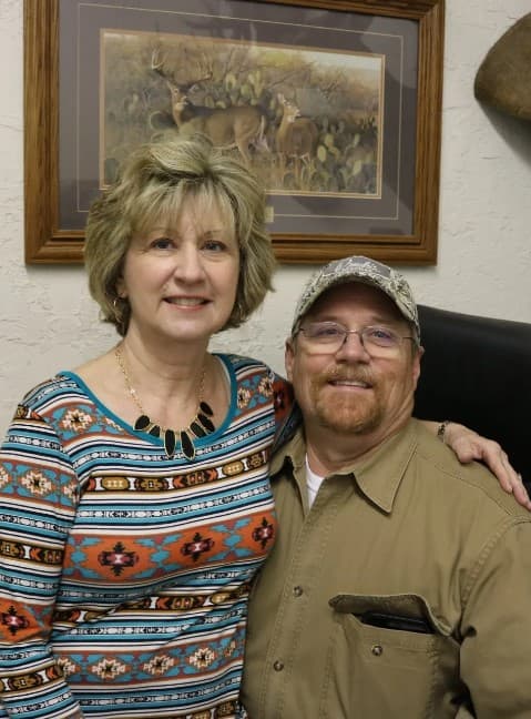 Kim & Edmond Pruski standing in their market